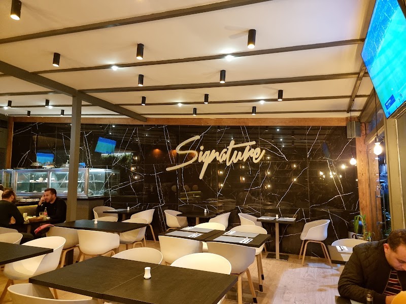 مطعم التوقيع